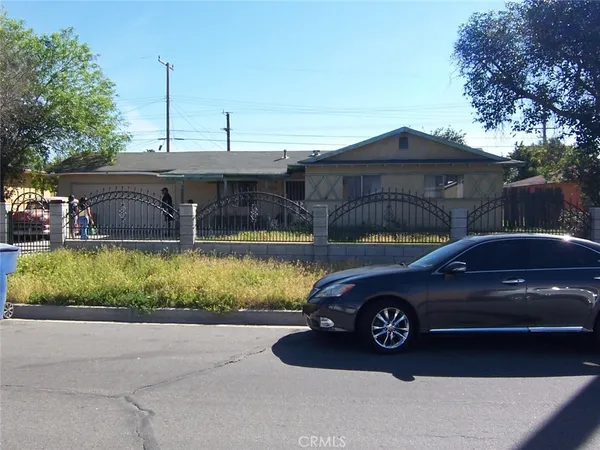 a view of a car parked in front of a house