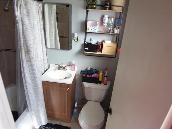 a bathroom with a toilet and a sink