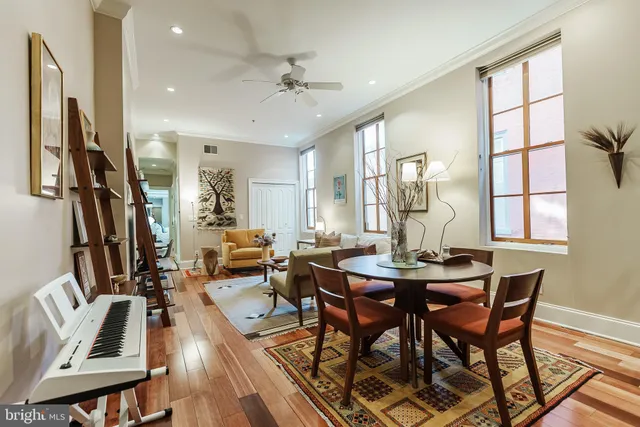 a view of a dining room with furniture window and wooden floor