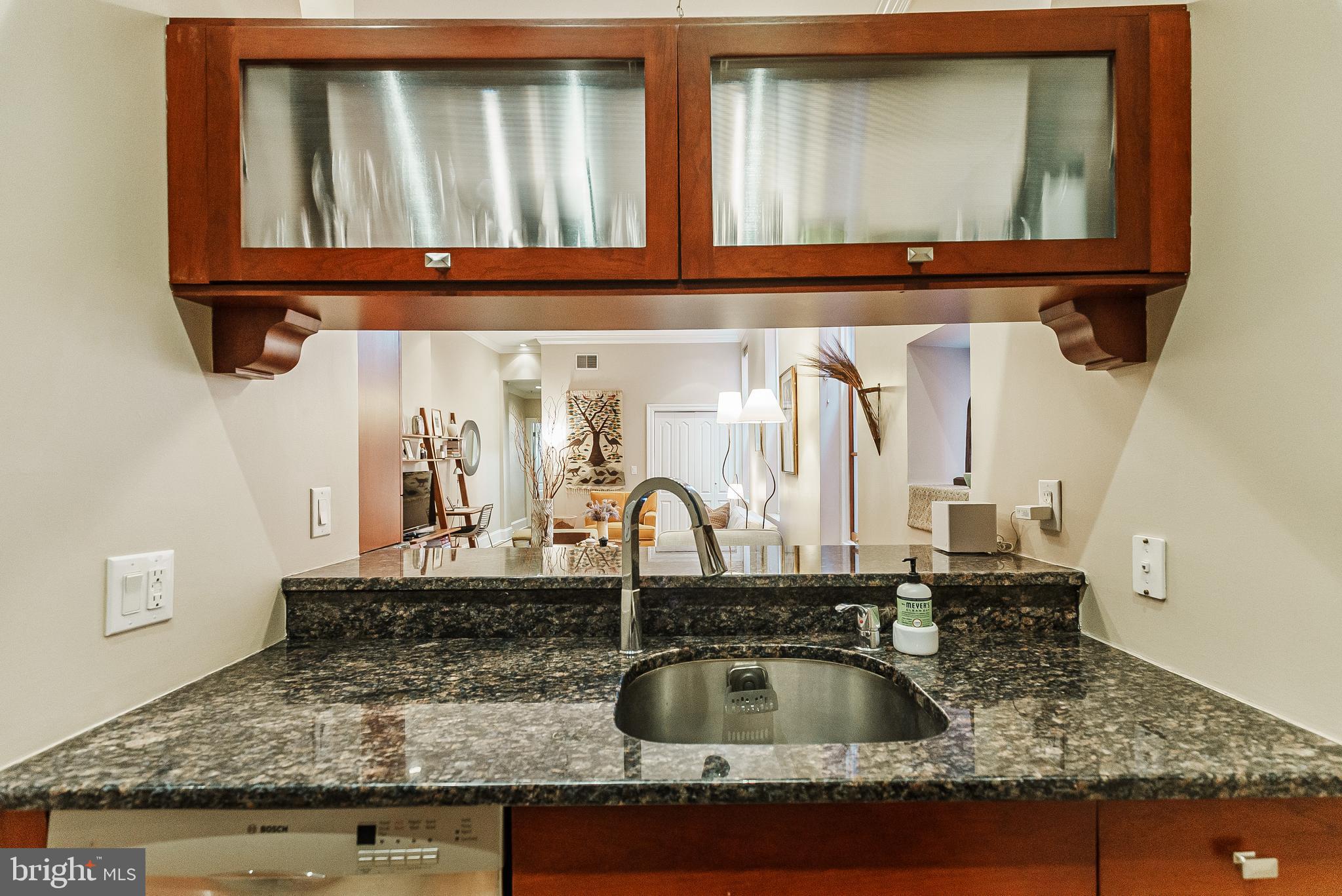 2049 Walnut Street, Unit 1R Philadelphia, PA 19103 - Photo 12 of 20 a kitchen with a sink and a mirror