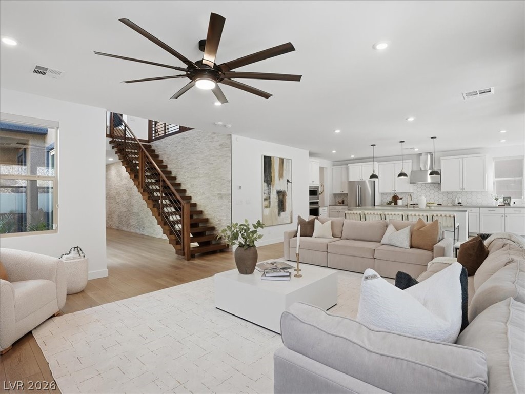 9725 Starlight Ridge Avenue Las Vegas, NV 89148 - Photo 1 of 47 This expansive open concept space features a bright kitchen and sleek hardwood floors.