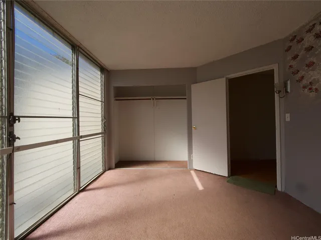 a view of empty room with windows