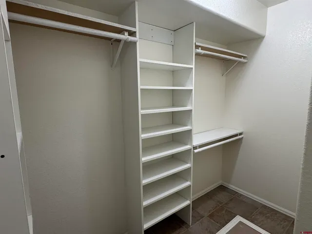a kitchen with stainless steel appliances a refrigerator sink and microwave