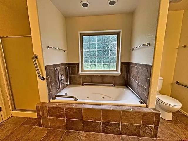 a bathroom with a sink a mirror and shower