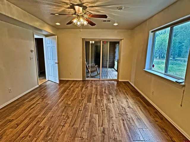 a view of entryway dining room and hall with wooden floor