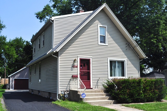 456 Franklin Boulevard Elgin, IL 60120 - Photo 1 of 14 front view of a house with a yard