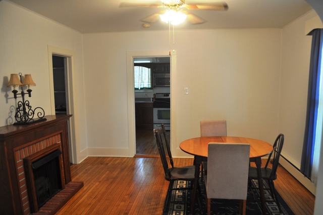 456 Franklin Boulevard Elgin, IL 60120 - Photo 6 of 14 a view of a dining room with furniture and wooden floor