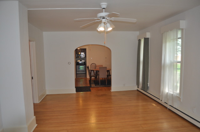 456 Franklin Boulevard Elgin, IL 60120 - Photo 7 of 14 a view of a room with a ceiling fan and hardwood floor