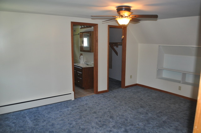 456 Franklin Boulevard Elgin, IL 60120 - Photo 8 of 14 an empty room with closet and a chandelier fan