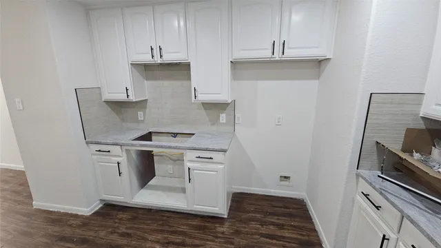 a kitchen with stainless steel appliances granite countertop a stove and a refrigerator