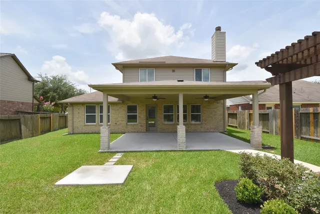 a front view of a house with a yard table and chairs
