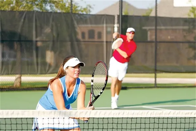 an aerial view of a house swimming pool a patio swimming pool and outdoor seating