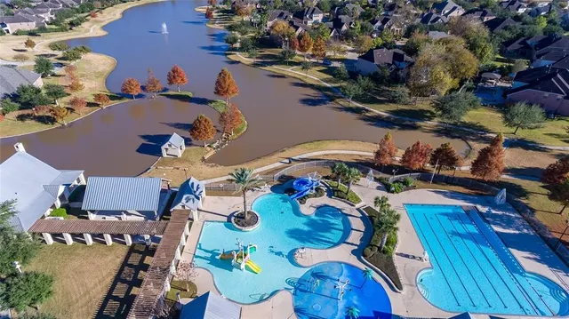 a front view of a building with a garden