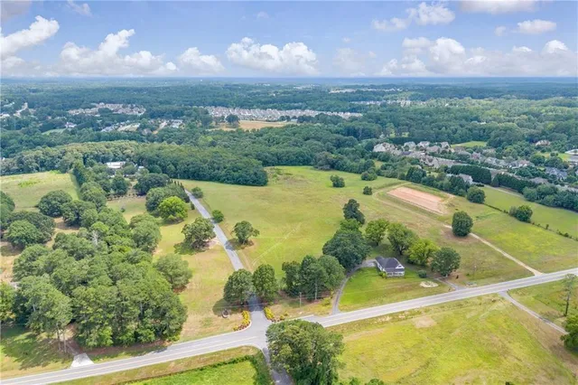 a view of a swimming pool with a yard