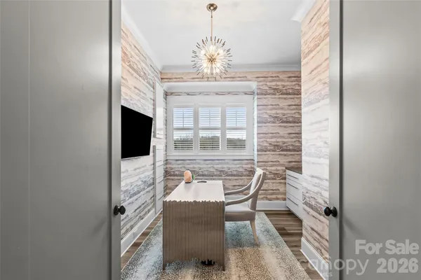 a view of a livingroom with furniture and a window