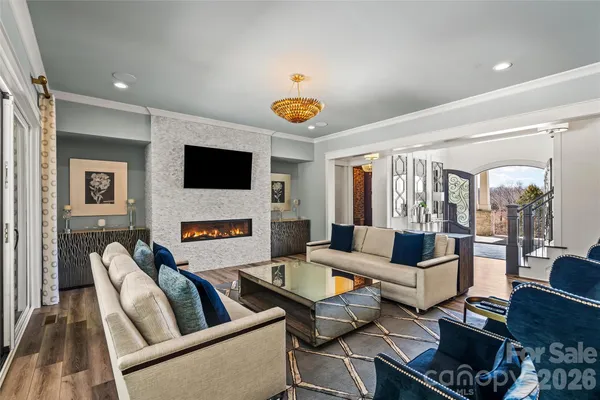 a living room with furniture fireplace and a flat screen tv