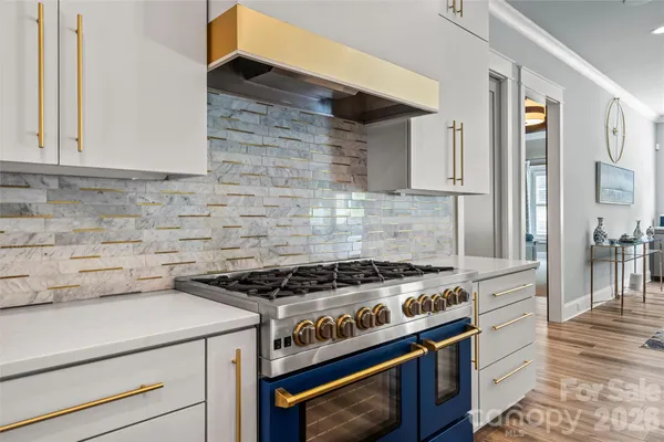 a kitchen with a stove and a cabinets