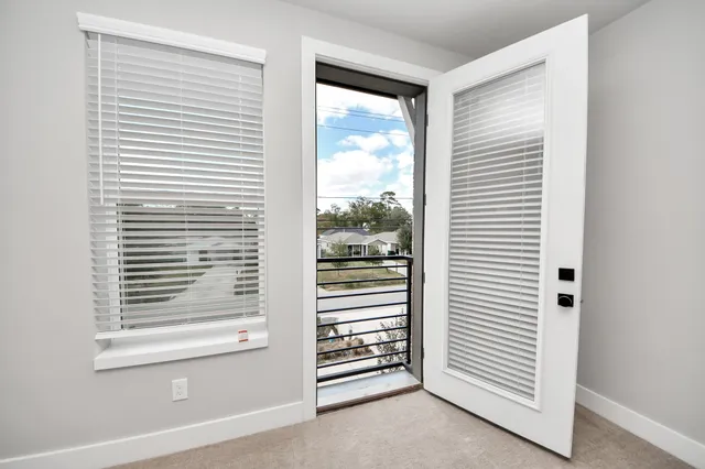 a view of a bedroom with a window