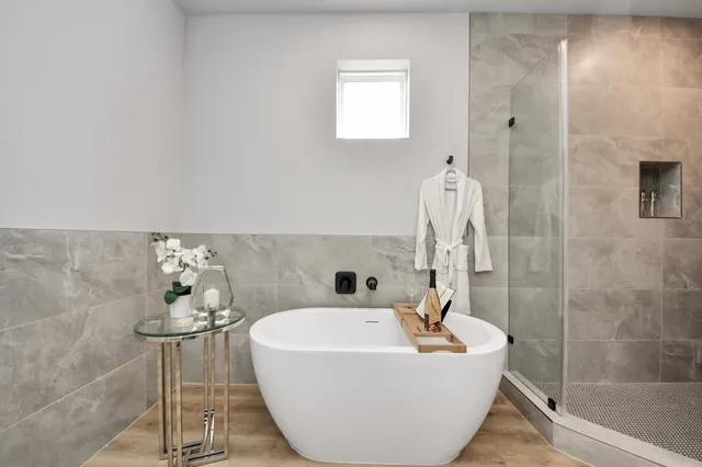 a bathroom with a sink a bathtub and a shower