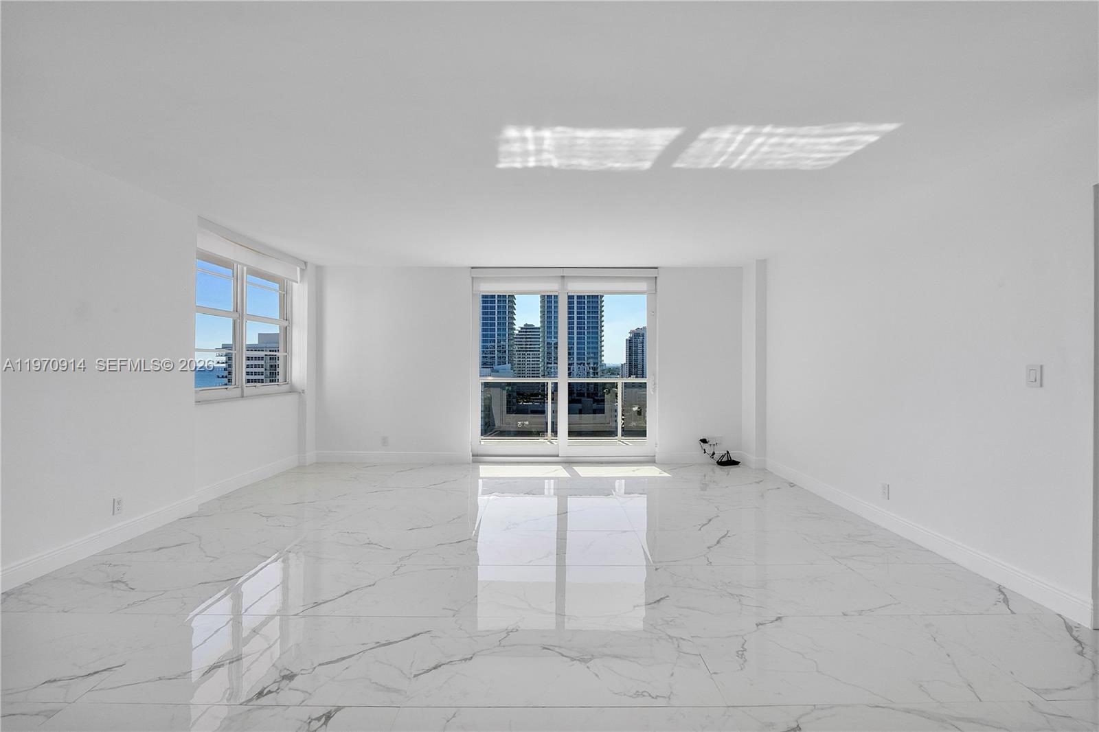336 North Birch Road, Unit PH Fort Lauderdale, FL 33304 - Photo 4 of 68 a view of an empty room with a window