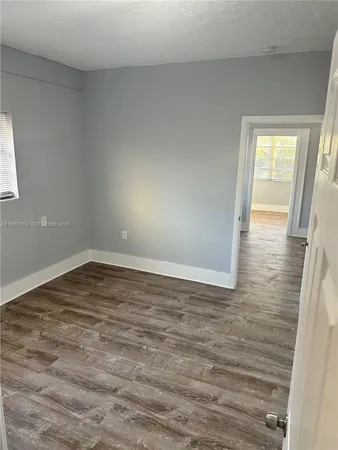 a view of an empty room and window