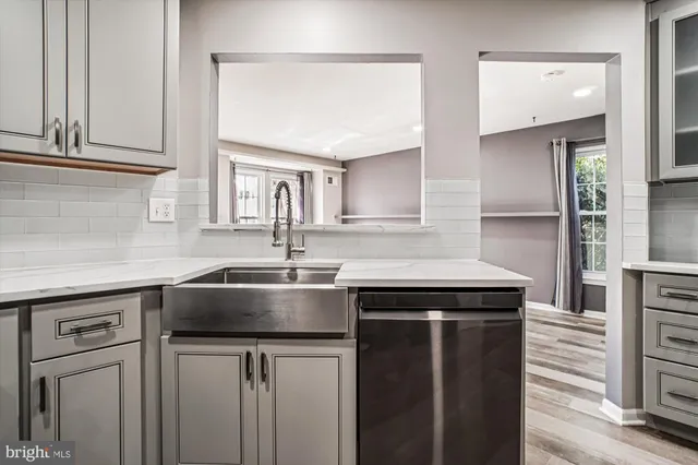 a kitchen with a sink and cabinets