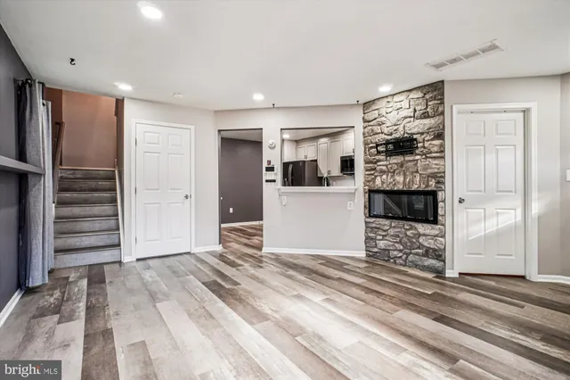 a view of kitchen with cabinets and wooden floor
