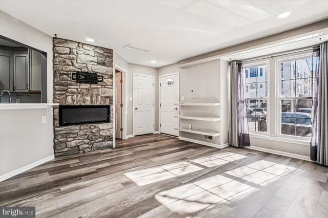 a view of a bedroom with furniture and window