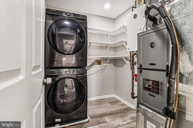 a view of a storage and utility room with washer and dryer