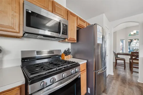 a kitchen with a stove and a microwave