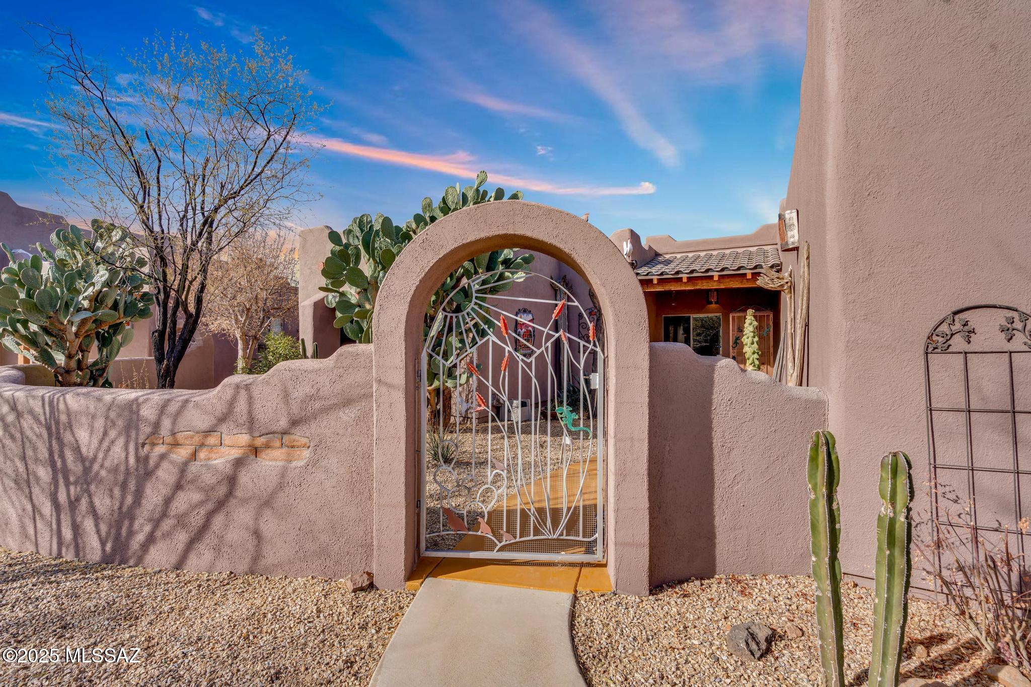 1794 Oahu Court Rio Rico, AZ 85648 - Photo 6 of 48 a view of a wooden door with a bench