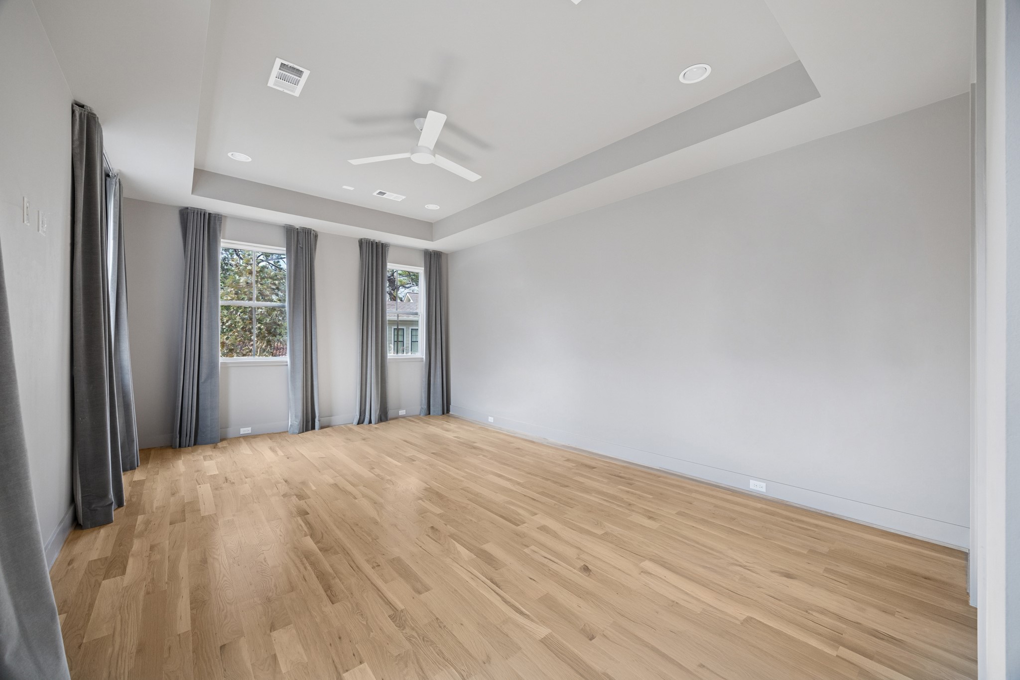4219 Alba Road Houston, TX 77018 - Photo 20 of 37 a view of an empty room with wooden floor and a window