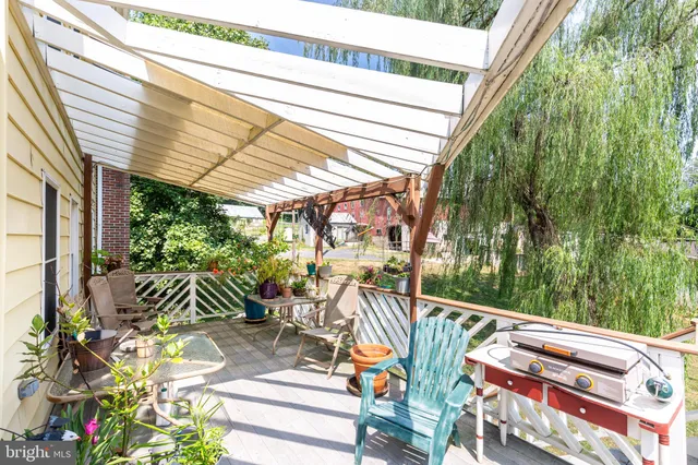 a view of balcony with furniture