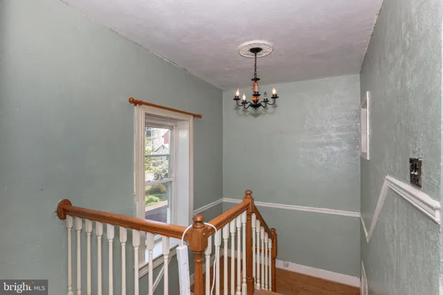 a spacious bathroom with a toilet sink and mirror