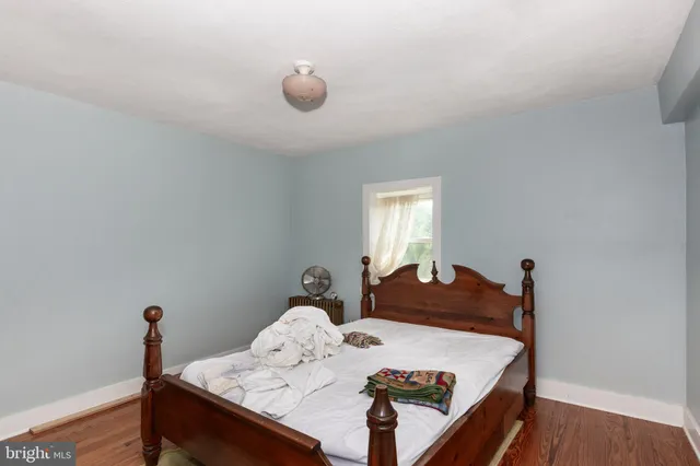 a bathroom with a sink mirror and shower