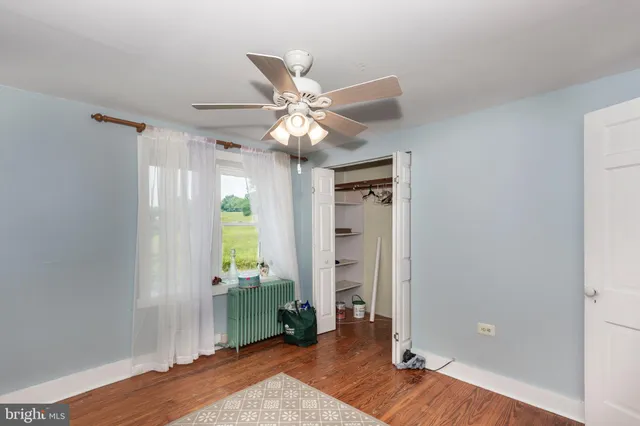 a view of a livingroom with furniture and staircase