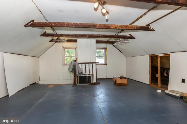 a bathroom with a sink vanity mirror and toilet