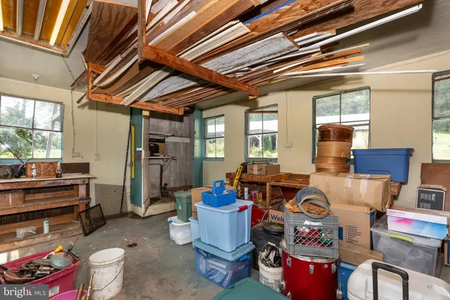a view of a storage room with a table and chairs