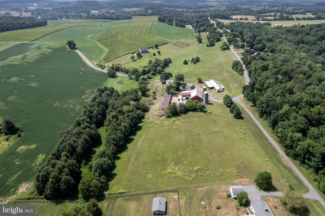 a view of a swimming pool with a yard