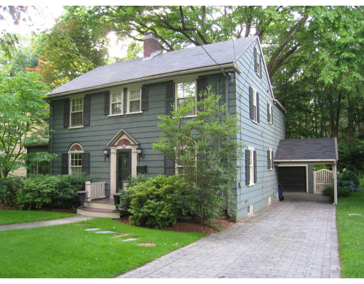 43 Beverly Road Newton, MA 02461 - Photo 1 of 1 a front view of a house with a garden and plants