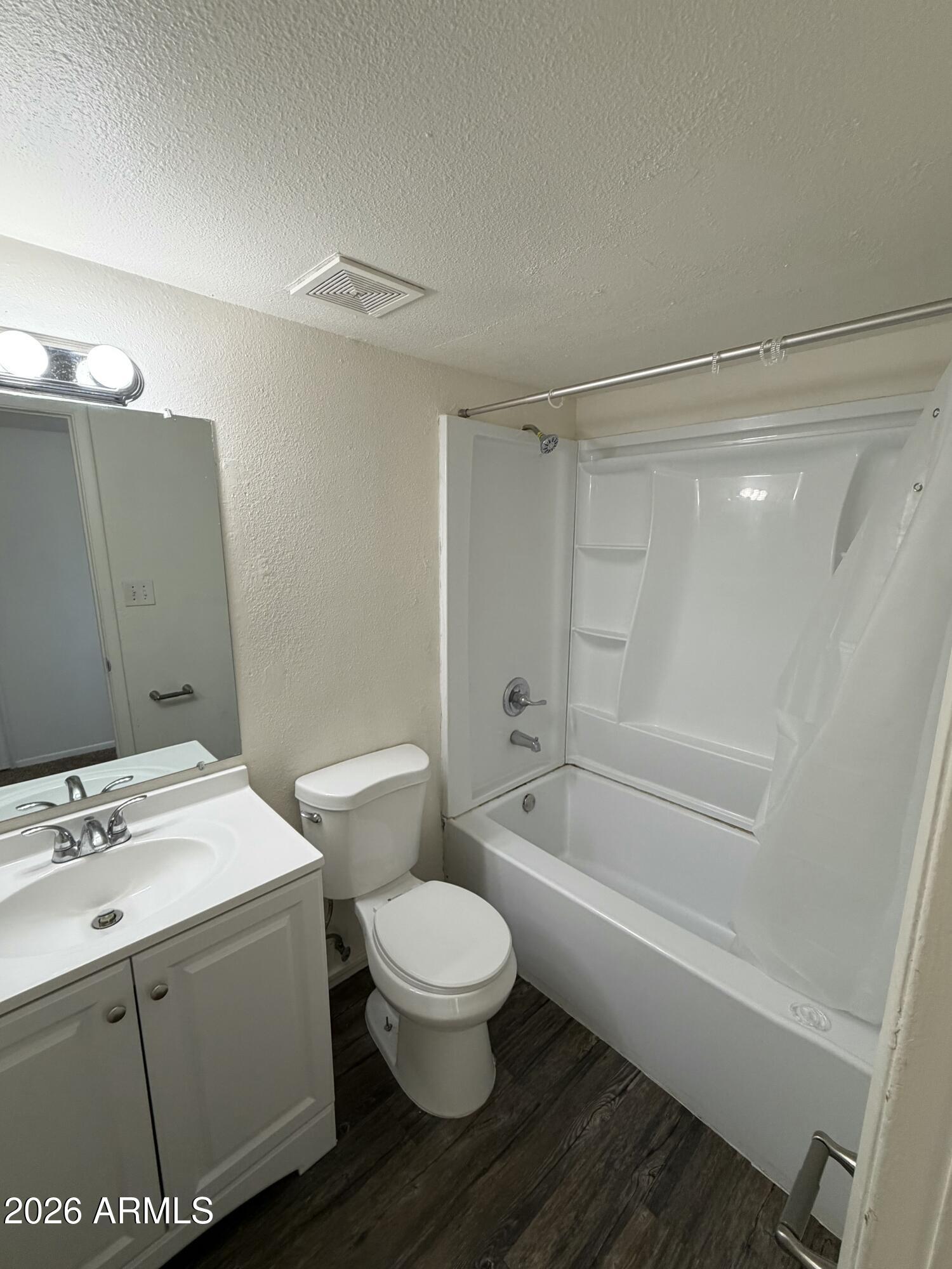 6817 West Devonshire Avenue Phoenix, AZ 85033 - Photo 10 of 11 a bathroom with a sink toilet and shower