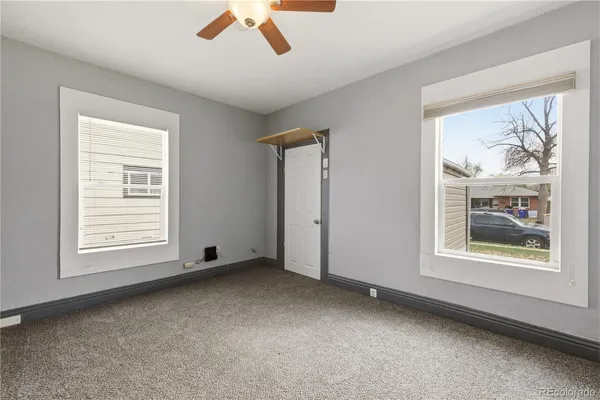 a view of an empty room with a window