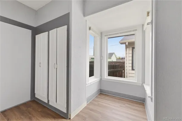 a view of a entrance and room with windows