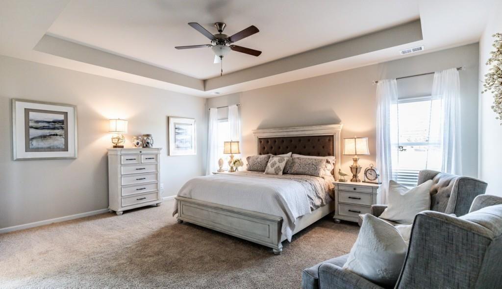 1234 Saddle Ridge Trail Calhoun, GA 30701 - Photo 12 of 18 a bedroom with a bed a couch and dresser