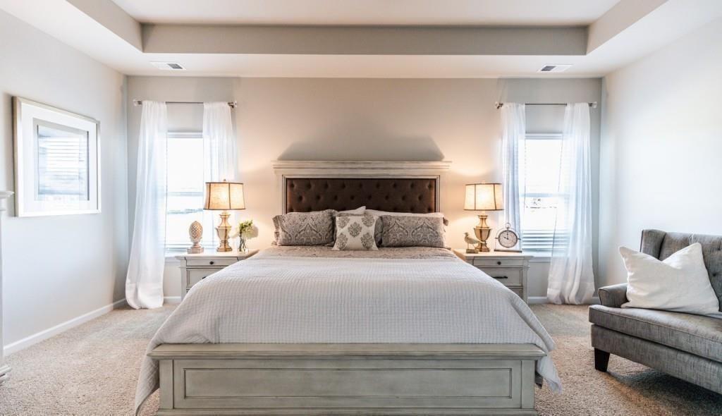 1234 Saddle Ridge Trail Calhoun, GA 30701 - Photo 13 of 18 a spacious bedroom with a bed and a couch