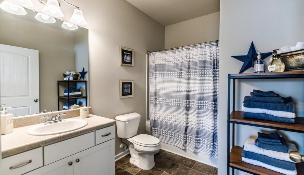 1234 Saddle Ridge Trail Calhoun, GA 30701 - Photo 18 of 18 a bathroom with a sink toilet and shower