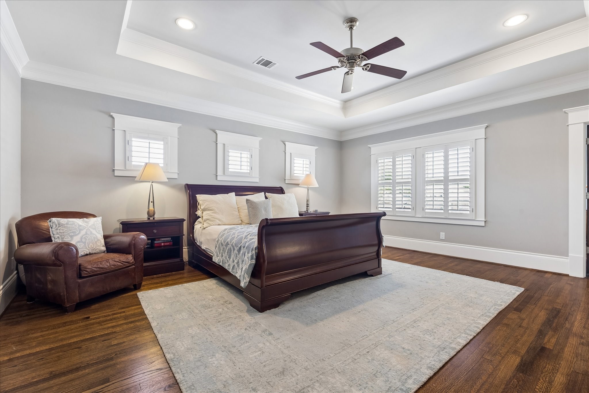 617 Harvard Street Houston, TX 77007 - Photo 16 of 39 a bedroom with a large bed and a couch