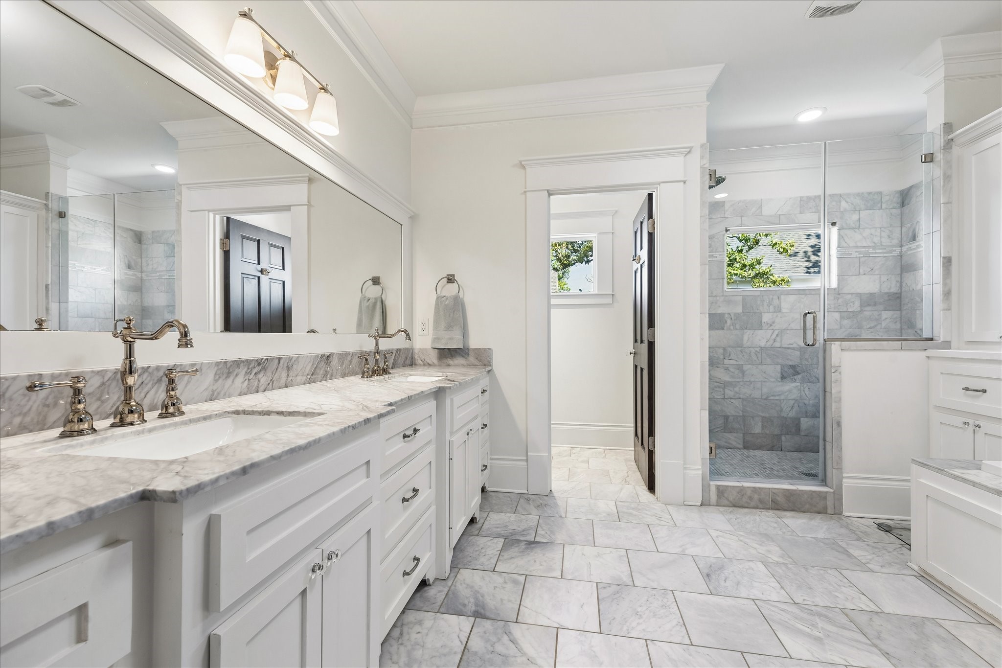 617 Harvard Street Houston, TX 77007 - Photo 17 of 39 a spacious bathroom with a granite countertop sink mirror and shower