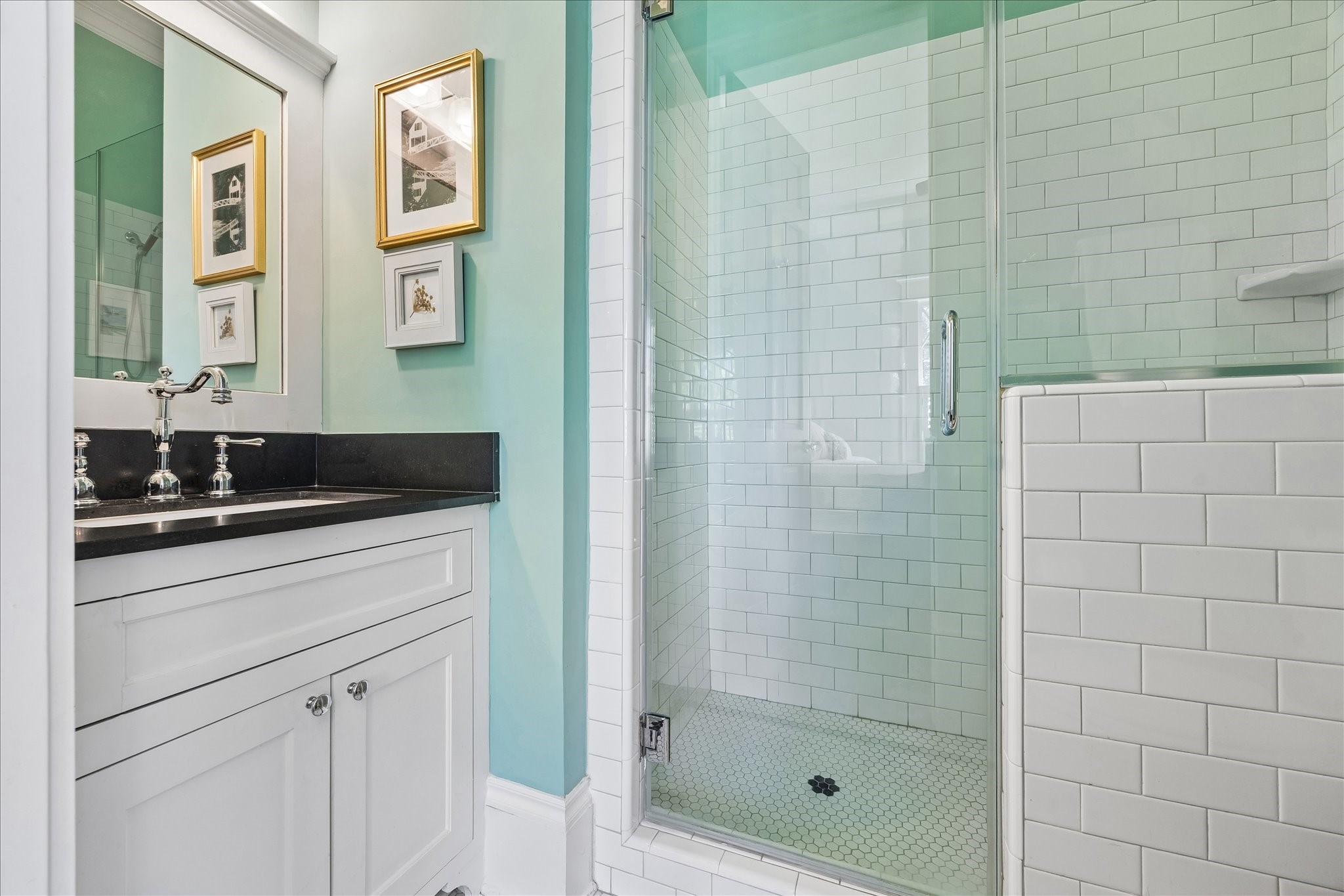 617 Harvard Street Houston, TX 77007 - Photo 21 of 39 a bathroom with a shower curtain and a sink