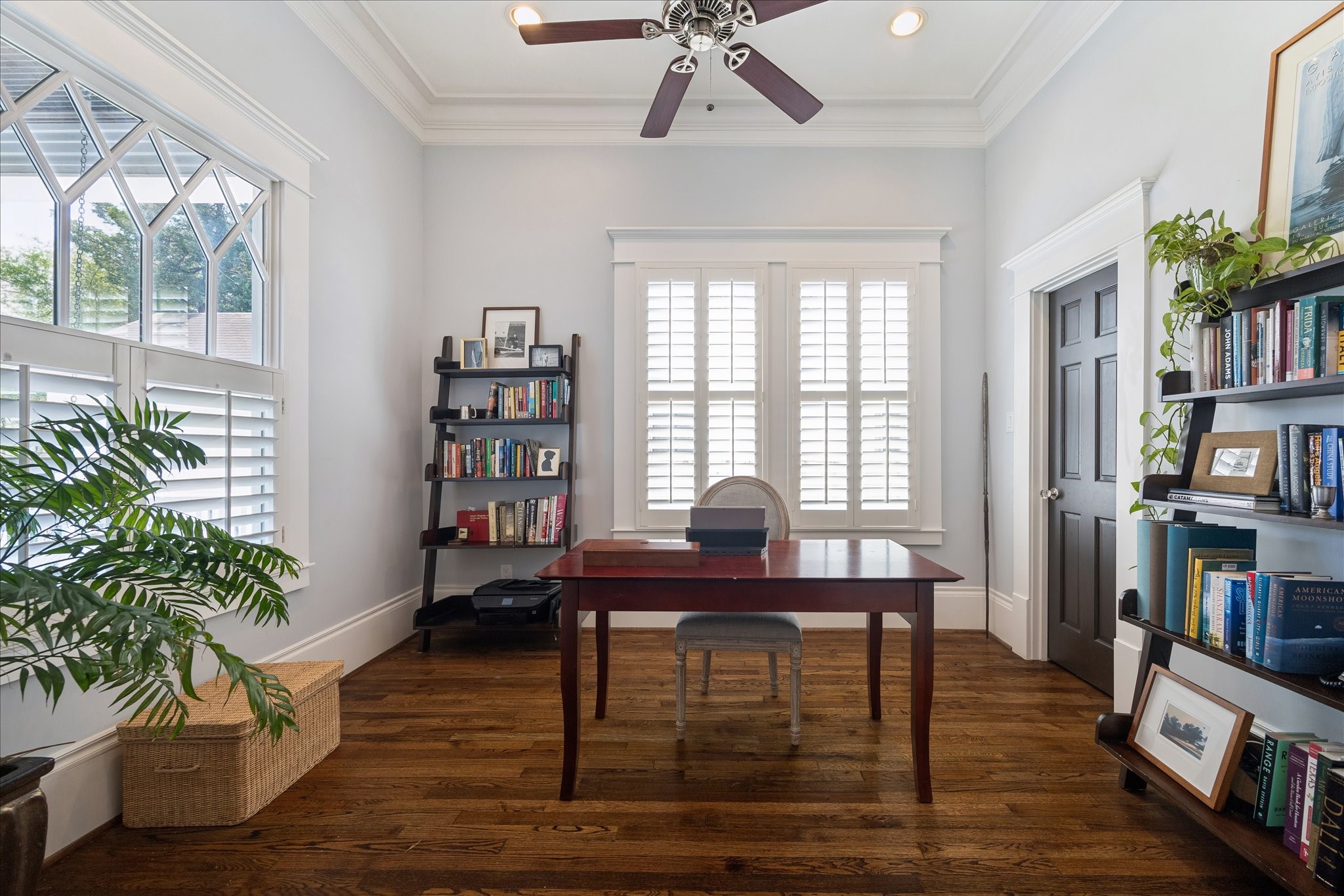 617 Harvard Street Houston, TX 77007 - Photo 6 of 39 a view of a workspace with furniture and a potted plant